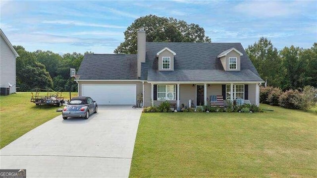 new england style home with covered porch, a front yard, and a garage