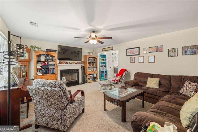 living room with carpet flooring and ceiling fan