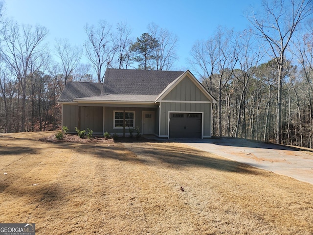 view of front of home with a porch and a garage