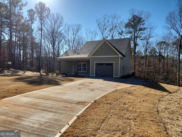 view of front of property featuring a garage and a front lawn