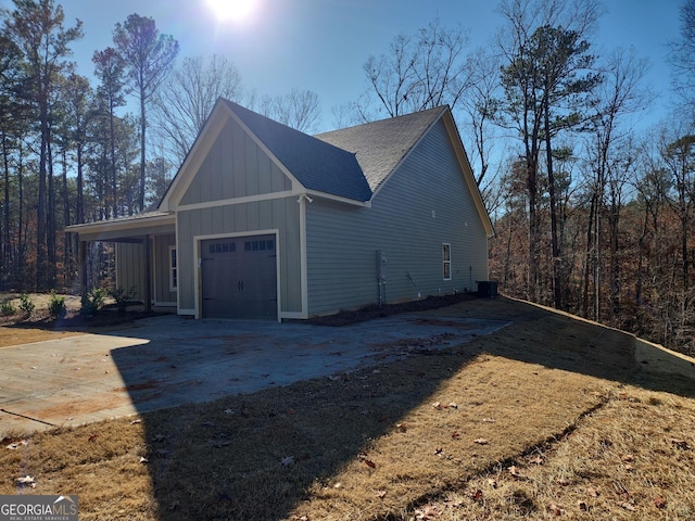 view of side of property featuring a garage