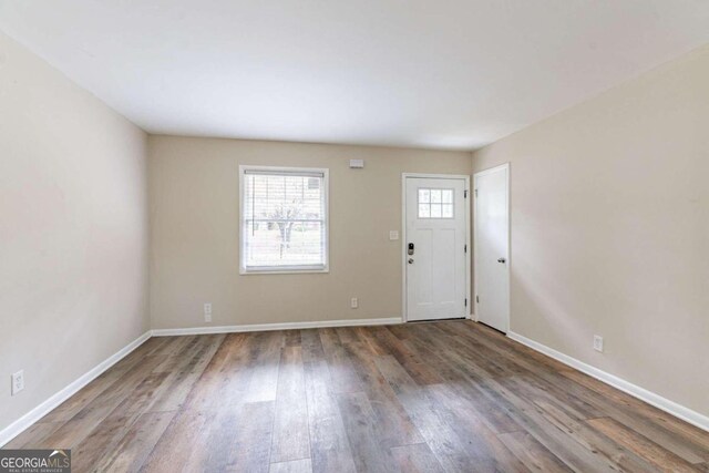 foyer entrance with dark hardwood / wood-style floors