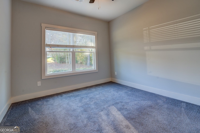 spare room featuring carpet and ceiling fan