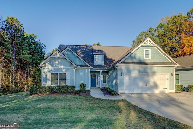 view of front of house featuring a front yard and a garage