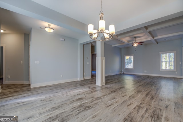 spare room with beam ceiling, coffered ceiling, light hardwood / wood-style floors, and ceiling fan with notable chandelier