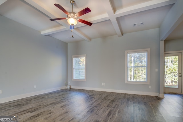 spare room featuring hardwood / wood-style floors, ceiling fan, and beamed ceiling