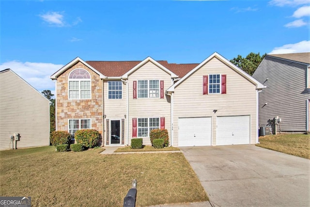 view of front of property featuring central AC unit, a garage, and a front yard