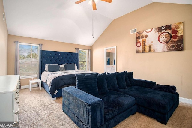 carpeted bedroom featuring ceiling fan and vaulted ceiling