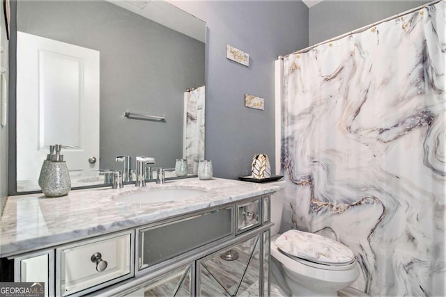 bathroom with vanity and toilet