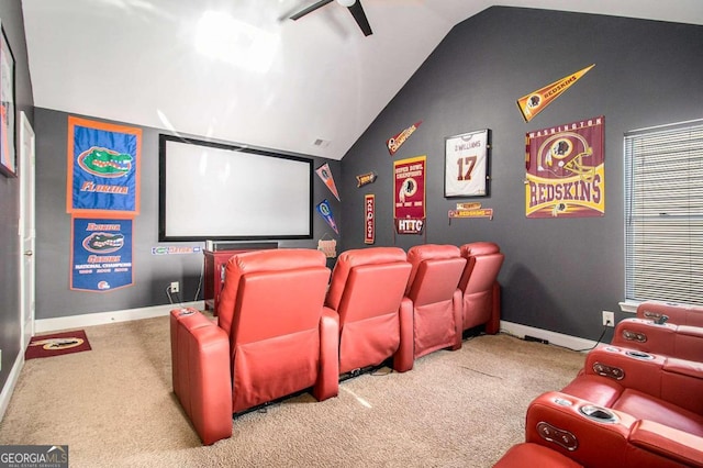 carpeted home theater room featuring ceiling fan and lofted ceiling