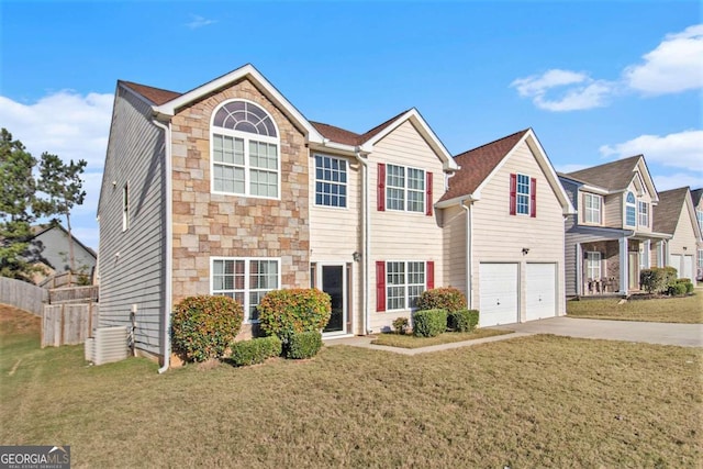 view of front of property with a garage and a front lawn