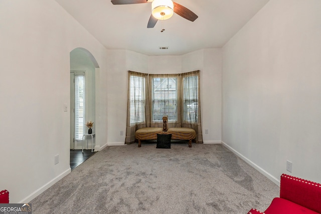 unfurnished room with carpet flooring and ceiling fan