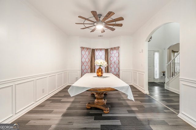 dining area with dark hardwood / wood-style floors, ceiling fan, and crown molding