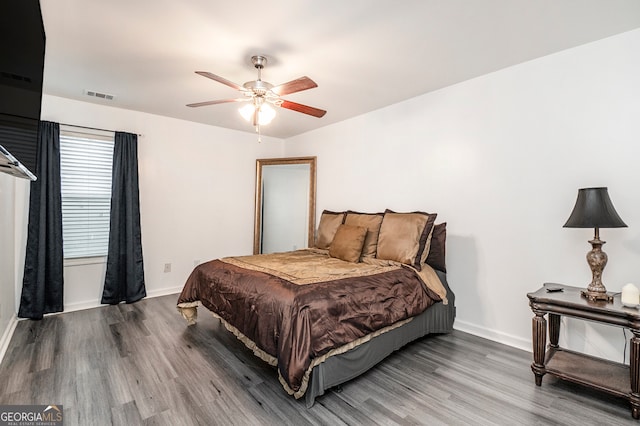 bedroom featuring ceiling fan and hardwood / wood-style flooring