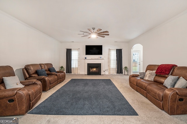 living room with light colored carpet, ceiling fan, and crown molding