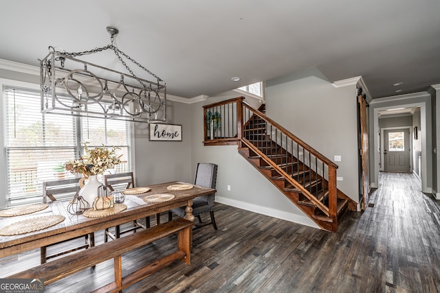 dining room featuring dark hardwood / wood-style flooring, an inviting chandelier, and crown molding