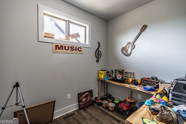 miscellaneous room featuring dark hardwood / wood-style floors