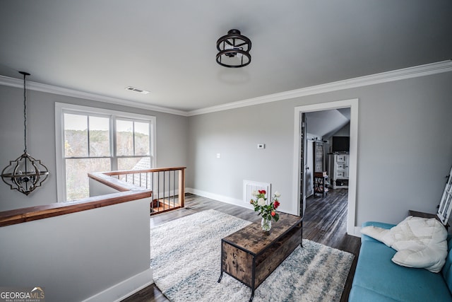 living room featuring dark hardwood / wood-style flooring and ornamental molding