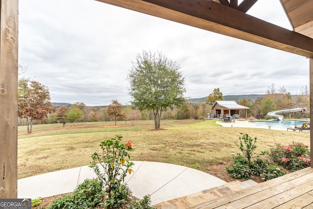 view of yard with an outbuilding and a patio