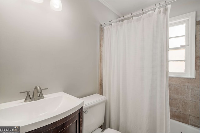 full bathroom with a wealth of natural light, crown molding, shower / bathtub combination with curtain, and toilet