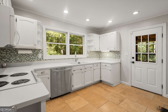 kitchen with white cabinets, plenty of natural light, white appliances, and sink