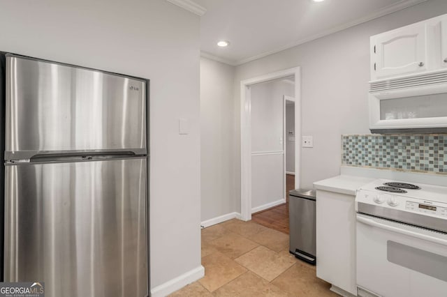 kitchen with white cabinets, backsplash, white appliances, and ornamental molding