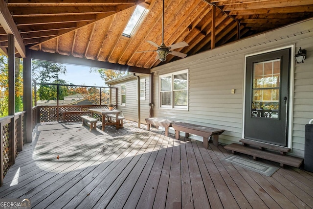 wooden deck featuring ceiling fan