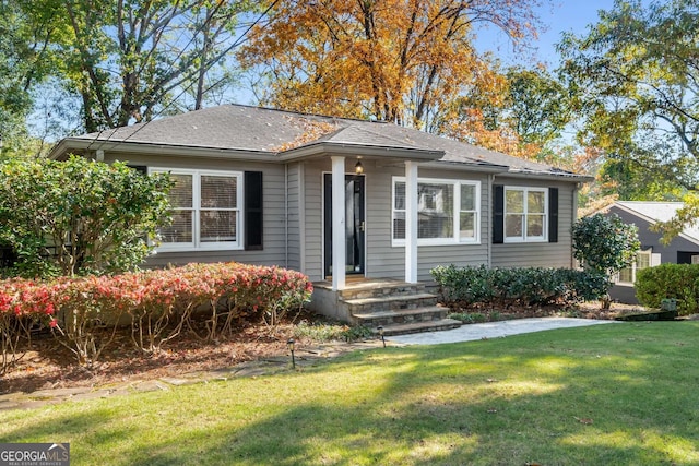 view of front of home with a front lawn