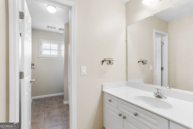 bathroom with vanity and tile patterned floors