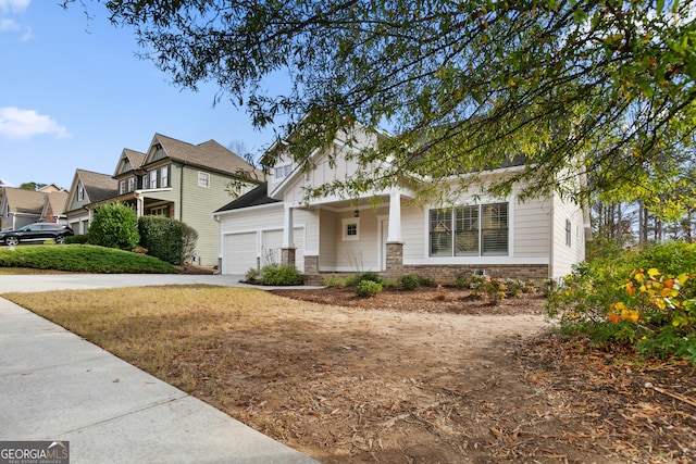 view of front of house featuring covered porch and a garage