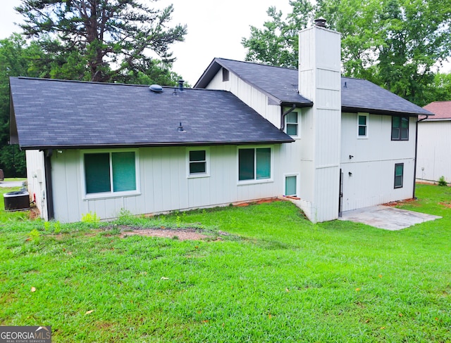 back of house with a yard