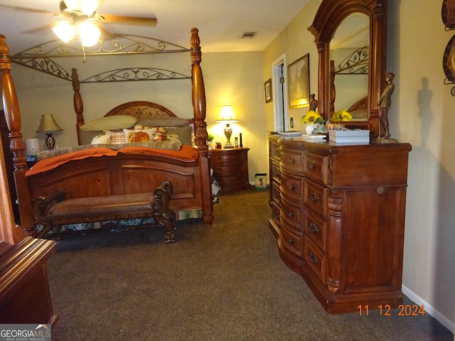 bedroom with dark carpet and ceiling fan