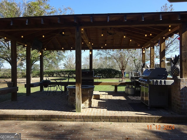 view of property's community with a gazebo and a patio area