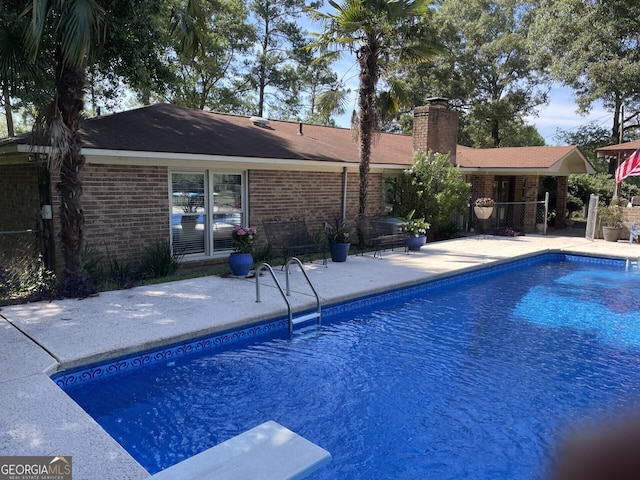 view of swimming pool featuring a patio