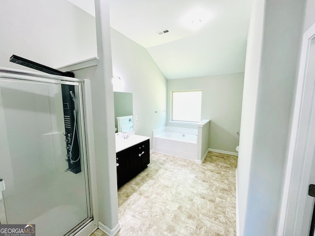 bathroom featuring plus walk in shower, vanity, and vaulted ceiling