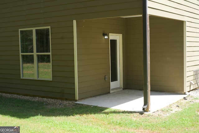 entrance to property with a patio