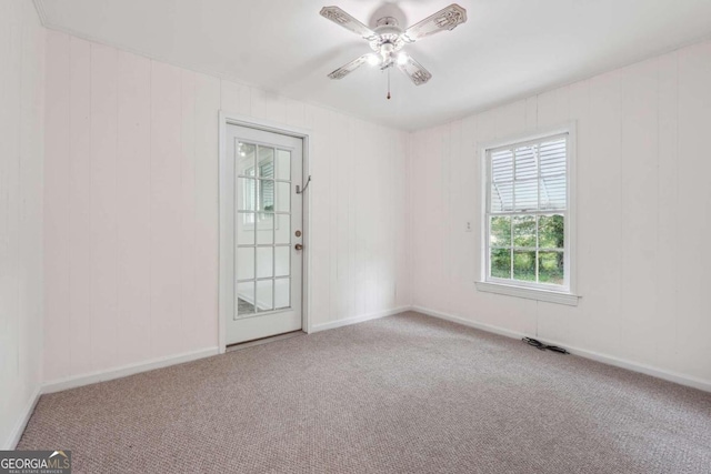 empty room with light carpet and ceiling fan