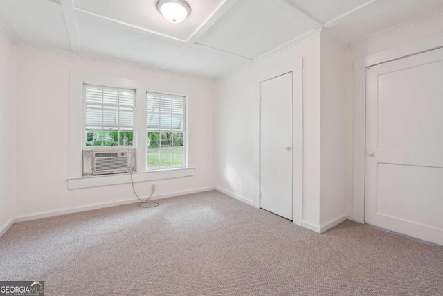 unfurnished bedroom featuring carpet flooring, cooling unit, ornamental molding, and a closet