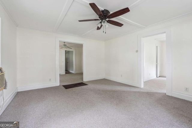 carpeted spare room with ceiling fan and ornamental molding