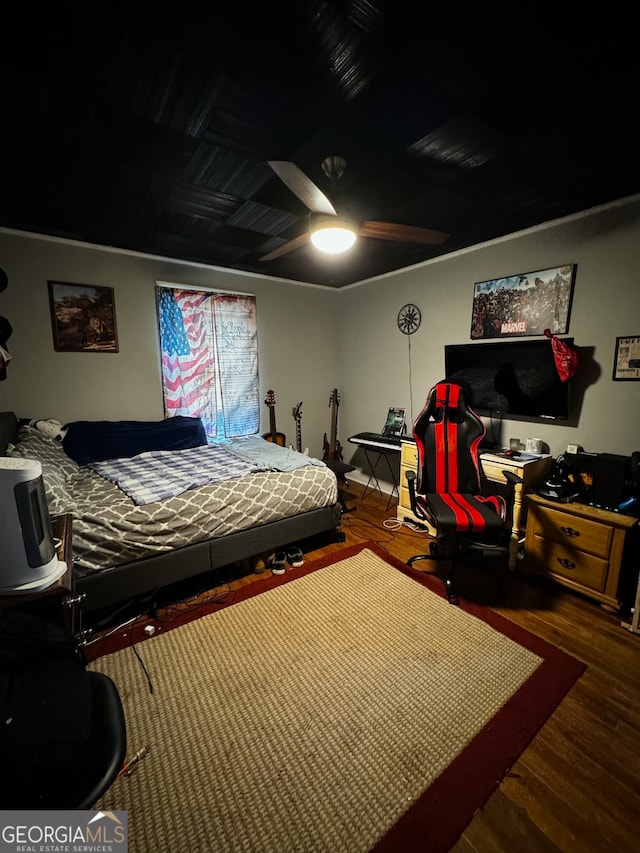 bedroom with hardwood / wood-style floors and ceiling fan