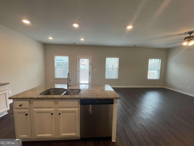 kitchen featuring sink, white cabinetry, dishwasher, light stone counters, and a kitchen island with sink