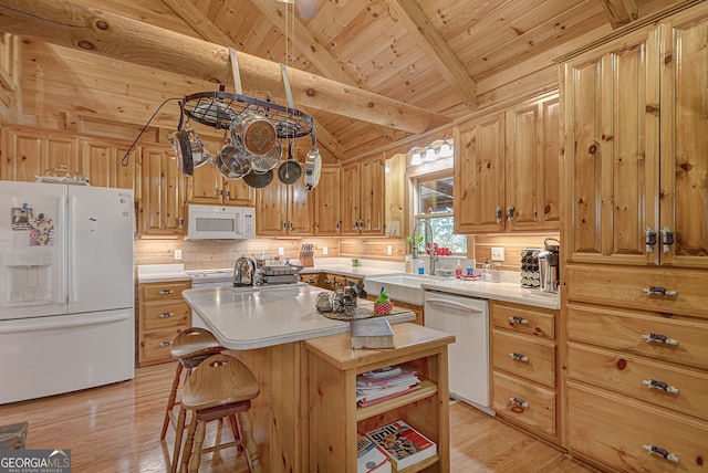 kitchen with light wood-type flooring, white appliances, lofted ceiling with beams, wooden ceiling, and a center island