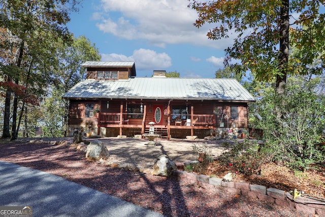 log home with covered porch