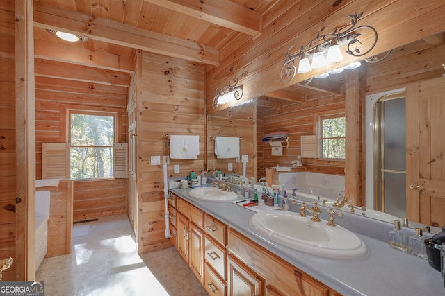 bathroom featuring a wealth of natural light and wood walls