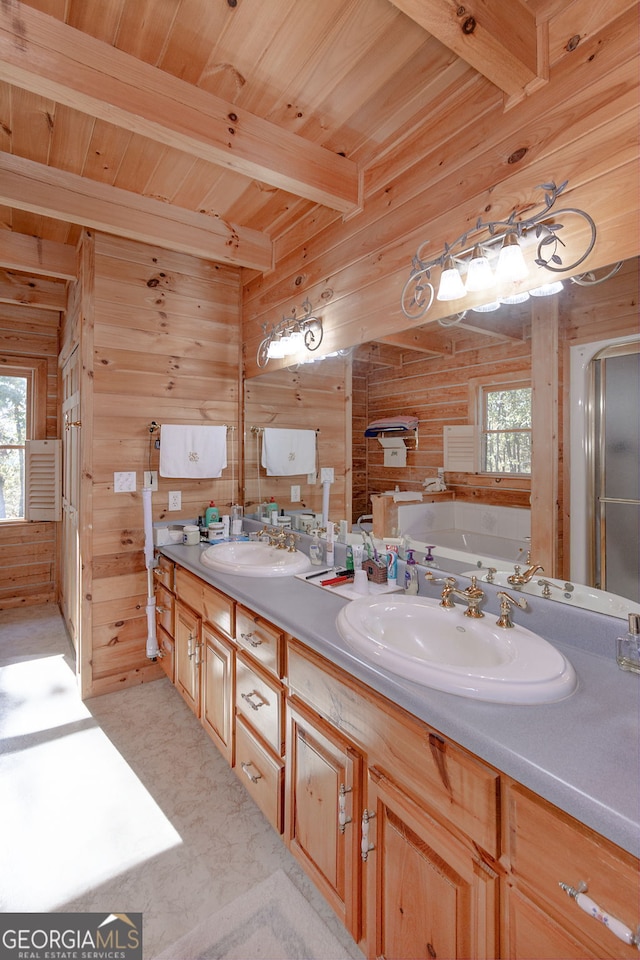 bathroom featuring beam ceiling, a tub, wooden ceiling, wooden walls, and vanity