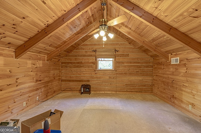 additional living space featuring vaulted ceiling with beams, wooden walls, carpet floors, and wood ceiling