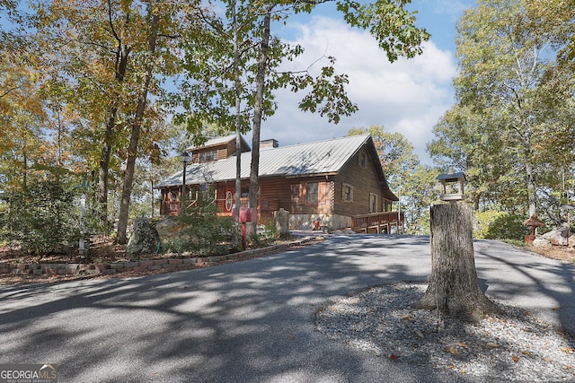 view of side of property featuring a deck