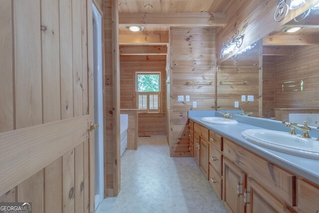 739 Barnes Mill Rd, Hamilton, GA 31811 - bathroom featuring a sink, wood walls, double vanity, and a tub to relax in
