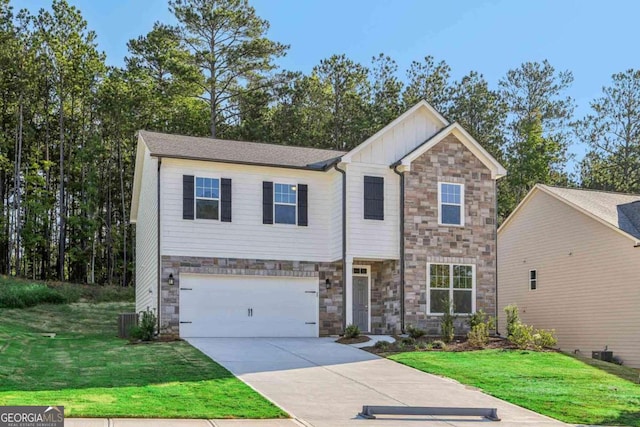 view of front of property with a front yard and a garage