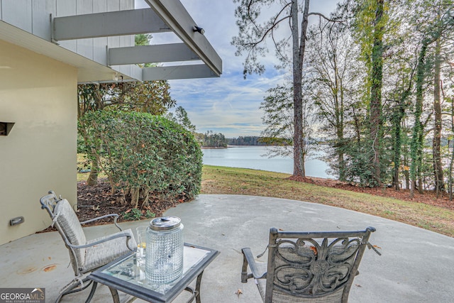 view of patio / terrace with a water view